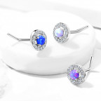 Zahnutý piercing do nosa - modrý opál